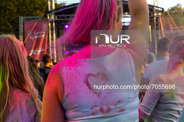 People enjoy  a  time out during the Colour Festival by the Tauron Arena in Krakow as the holiday season reaches an end and families take th...
