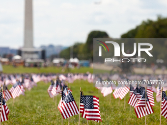 2,977 American flags decorate the National Mall at the Capitol, one for each victim of the September 11th World Trade Center attacks. (