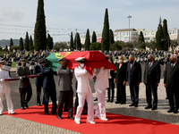 Portuguese military personnel carries the flag-drapped coffin of the late former Portuguese President Jorge Sampaio into Jeronimos Monastery...