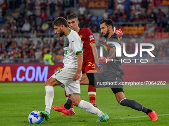 Domenico Berardi of Sassuolo Calcio and Rui Patricio of AS Roma in action during the  Italian Football Championship League A 2021/2022 match...
