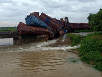 Derailed bogies and engine of a goods train derailed at a bridge as it collapsed in the water due to heavy rain in between the Talcher-Angul...