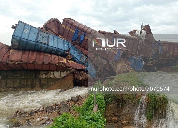 Derailed bogies and engine of a goods train derailed at a bridge as it collapsed in the water due to heavy rain in between the Talcher-Angul...