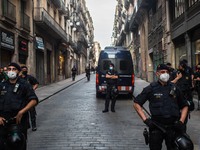 Police are seen preventing protesters from approaching the generality of Catalonia.
The political party The Popular Unity Candidacy (CUP) an...