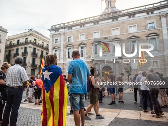 Protester in front of the Generality of Catalonia is seen with Catalan independence flag.
The political party The Popular Unity Candidacy (C...