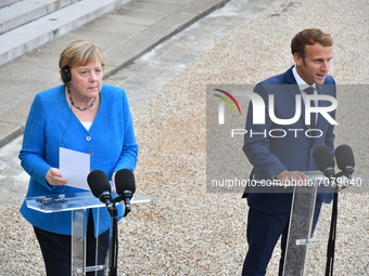 German Chancellor Angela Merkel  and French President Emmanuel Macron speak to the press at the Presidential Elysee Palace  for a meeting an...