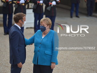 French President Emmanuel Macron welcomes German Chancellor Angela Merkel for a meeting and a working dinner at the Presidential Elysee Pala...