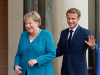 French President Emmanuel Macron welcomes German Chancellor Angela Merkel for a meeting and a working dinner at the Elysee Presidential  Pal...
