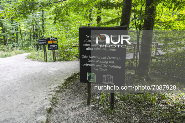 A sign on a path at Plitvice Lakes National Park in Croatia on September 15, 2021. In 1979, Plitvice Lakes National Park was inscribed on th...