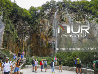Tourists watch the Great Waterfall (Veliki Slap) at Plitvice Lakes National Park in Croatia on September 15, 2021. In 1979, Plitvice Lakes N...