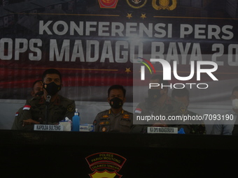 Central Sulawesi Provincial Police Chief Inspector General Rudy Sufahriadi (left) answers reporters' questions when interviewed regarding a...