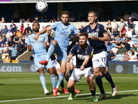 L-R Matt Godden of Coventry City  and George Saville of Millwall during The Sky Bet Championship between Millwall and Coventry City at The D...