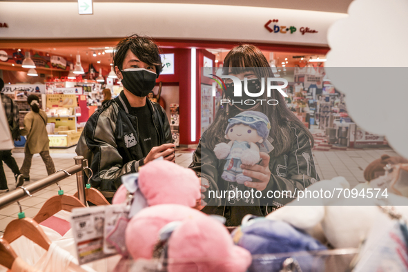 04/09/2021 Tokyo, Japan. 
A young couple chooses some puppets in a shopping mall.
The Covid emergency in Japan continues and the tourist res...