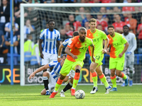 
Lewis Grabban of Nottingham Forest runs with the ball during the Sky Bet Championship match between Huddersfield Town and Nottingham Forest...