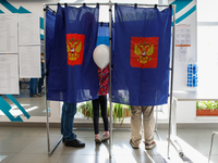 People at a polling station during voting in the State Duma of the Russian Federation in St. Petersburg. Saint Petersburg, Russia, September...