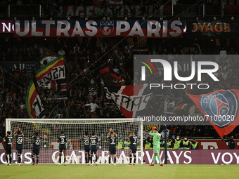 PSG players celebrate victory with his supporters after the Ligue 1 Uber Eats match between Paris Saint Germain and Lyon at Parc des Princes...