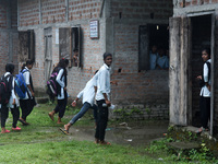 Students of class Xth arrives in a school after Assam state government resumes classes for class 10th students, on 20 September 2021 in Barp...