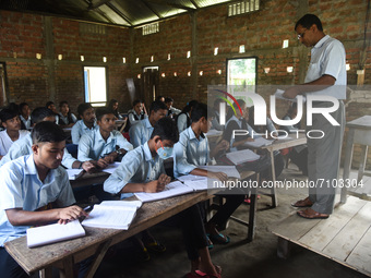 Students of class Xth attend a class in a school after Assam state government resumes classes for class 10th students, on 20 September 2021...