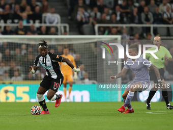 Allan Saint-Maximin of Newcastle United in action with Leeds United's Kalvin Phillips   during the Premier League match between Newcastle Un...