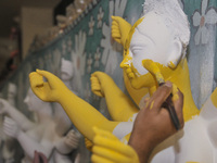 Artist Gourango Paul paints a sculpture of Goddess Durga Idols as part of preparation for the upcoming Hindu religious Durga Puja festival....