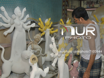 Artist Nondi Paul paints a sculpture of Goddess Durga Idols as part of preparation for the upcoming Hindu religious Durga Puja festival. On...