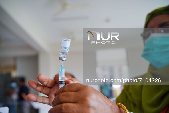  A health worker is preparing a syringe of Sinopharm dose during a national health campaign  against COVID-19, to reduce infections by the c...