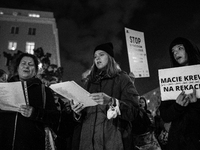 (EDITOR'S NOTE: Image was converted to black and white) Group of activists and citizens gathered in front of Polish Border Guard's HQ in War...