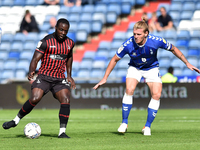  Oldham Athletic's Carl Piergianni tussles with Olufela Olomola of Hartlepool United during the Sky Bet League 2 match between Oldham Athlet...