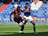  Oldham Athletic's Kyle Jameson tussles with Olufela Olomola of Hartlepool United during the Sky Bet League 2 match between Oldham Athletic...