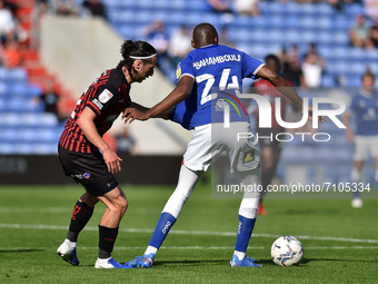  Oldham Athletic's Dylan Bahamboula tussles with Jamie Sterry of Hartlepool United during the Sky Bet League 2 match between Oldham Athletic...