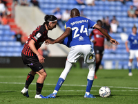  Oldham Athletic's Dylan Bahamboula tussles with Jamie Sterry of Hartlepool United during the Sky Bet League 2 match between Oldham Athletic...