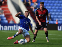  Oldham Athletic's Hallam Hope tussles with Mark Shelton of Hartlepool United during the Sky Bet League 2 match between Oldham Athletic and...