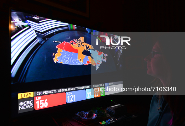 A woman watches the election results live on CTV News.
Early election results predict Liberal leader Justin Trudeau to win enough seats in t...