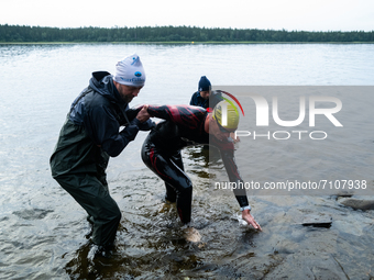 Athletes reaches the swim out, at Swedeman 2021 in Åre, Sweden (