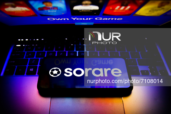 Sorare logo displayed on a phone screen and Sorare website displayed on a laptop screen are seen in this illustration photo taken in Krakow,...