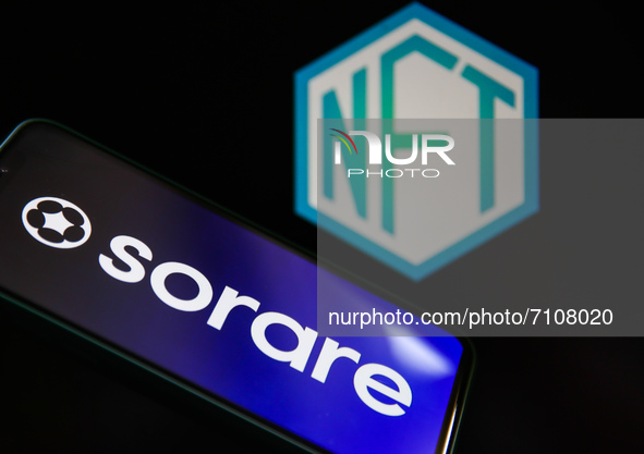 Sorare logo displayed on a phone screen and NFT logo displayed on a laptop screen are seen in this illustration photo taken in Krakow, Polan...