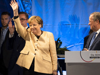 German Chancellor Angela Merkel and chancellor candidate of Germany's conservative Christian Democratic Union (CDU) party Armin Laschet atte...