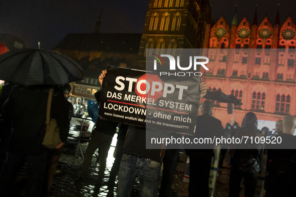 A small group of protesters protests during a campaign rally attended from German Chancellor Angela Merkel and chancellor candidate of Germa...