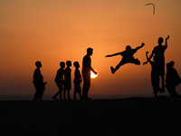 Palestinian boys play during sunset in northern Gaza Strip, on September 21, 2021.
 (