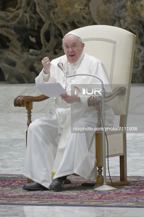 Pope Francis sits during his weekly general audience in the Paul VI Hall at the Vatican, Wednesday, Sept. 22, 2021. 