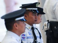 MANILA, Philippines - Security personnel on their duty posts, moments before the metro wide earthquake drill at one of the participating est...