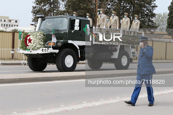 The coffin of the former head of state and president of the National Assembly, Abdelkader Bensalah, by a military vehicle towards the cemete...