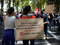 A placard reads 'Disabled pupils, inclusion or mistreatment ? Lack of AESH, 25 pupils in difficulty'. AESH is the acronym for people who hel...