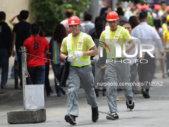 Libis, Quezon City Philippines - Rescue workers rush to a scene during the nationwide earthquake drill in Libis, Quezon City on Thursday, Ju...
