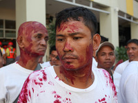 Libis, Quezon City Philippines - A man is covered in fake blood before the nationwide earthquake drill in Libis, Quezon City on Thursday, Ju...