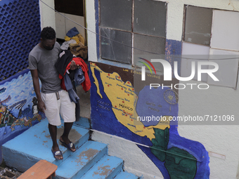 A Haitian migrant in front of a mural in the courtyard of the Casa Tochán (Our house in Nahuatl) shelter, located on the outskirts of Mexico...