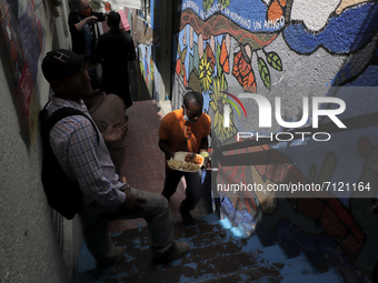 A Haitian migrant climbs the stairs in a corridor of the Casa Tochán (Our house in Nahuatl) shelter, located on the outskirts of Mexico City...