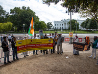 A small group of demonstrators gathers to protest Indian Prime Minister Narendra Modi during his visit to the United States at the White Hou...