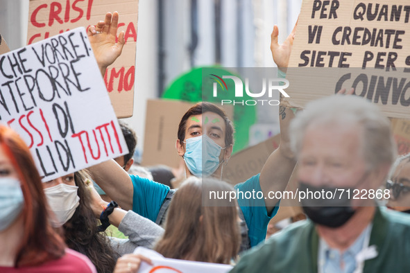 People take part in the demonstration 'Fridays for Future' to denounce the environmental devastation in Piazza Arnaldo in Brescia, Italy, on...