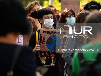 A demonstrator holds a protest sign during the march for the environment. Lisbon, September 24, 2021. The student organization that emerged...