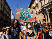 People take part in a demonstration for the Friday For Future, in Turin, Italy, on September 24, 2021. (